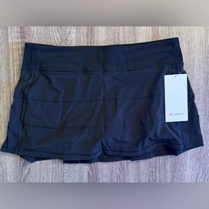 New with tags Lululemon Pace rival skirt, Black, size 10. Can be used for tennis